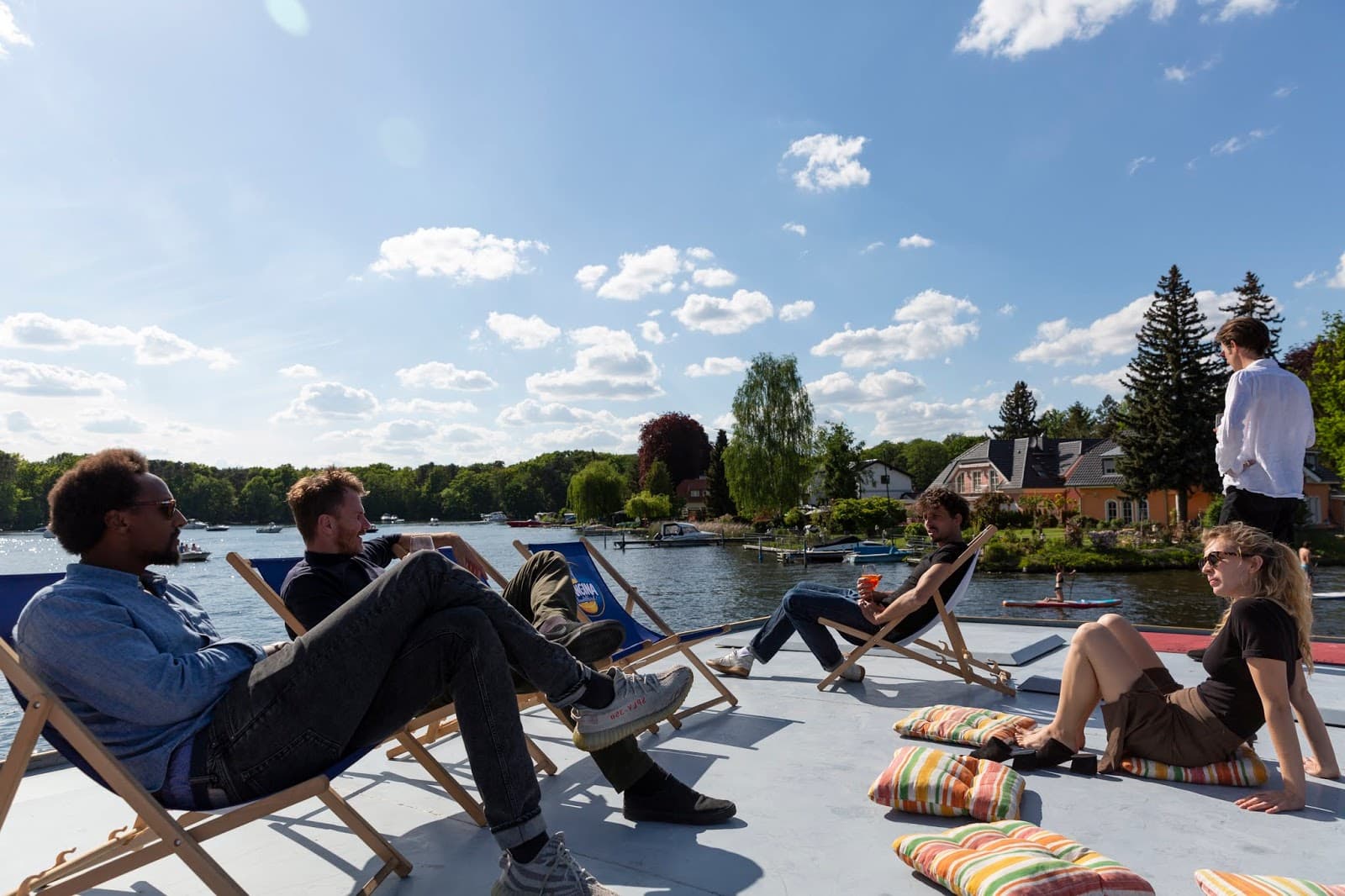 berlin boat event guests seated and talking.